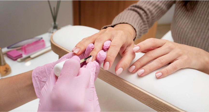 Nail extensions โNail technician prepping natural nails for extensions.โ